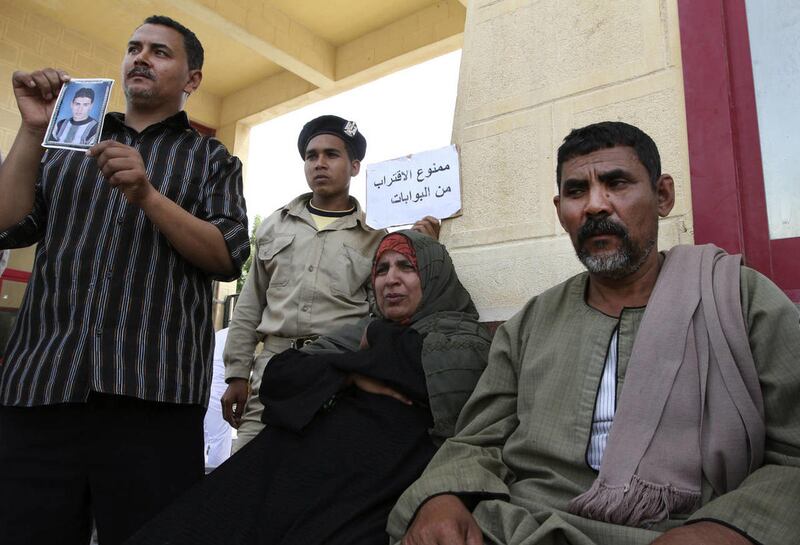 Egyptian relatives of border policeman kidnapped last Thursday protest at the Rafah border crossing between Egypt and the Gaza strip, Sunday, May 19, 2013. Rafah, the main crossing point into the Gaza Strip, was closed by policemen Friday, barring people