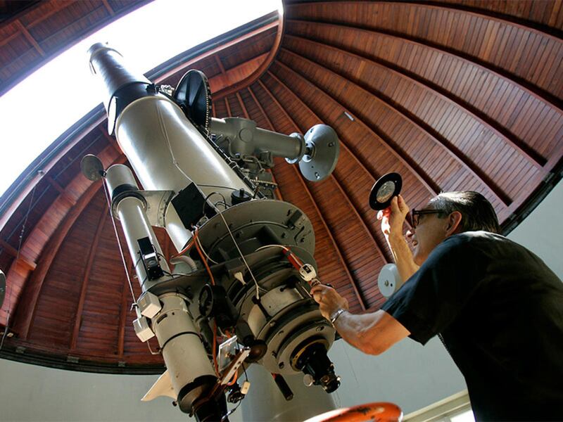 The Rev. Emmanuel Carreira operates the telescope at the Vatican Observatory in Castel Gandolfo, south of Rome, on June 23, 2005. The Vatican Observatory, one of the world\'s oldest astronomical institutes, selects young, promising scholars for courses at