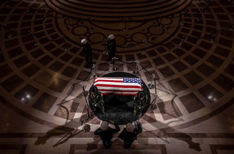 Police officers stop and salute the casket of the late U.S. Sen. Dianne Feinstein during a day of lying in state at San Francisco City Hall.