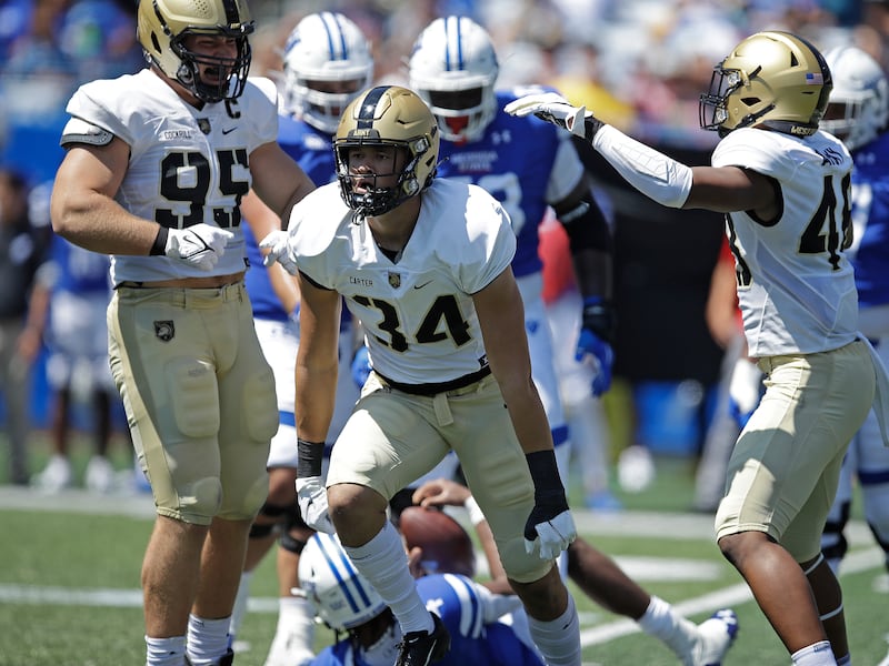Army linebacker Andre Carter II celebrates after sacking Georgia State quarterback Cornelious Brown IV during the first quarter of a game on Saturday, Sept. 4, 2021, in Atlanta.