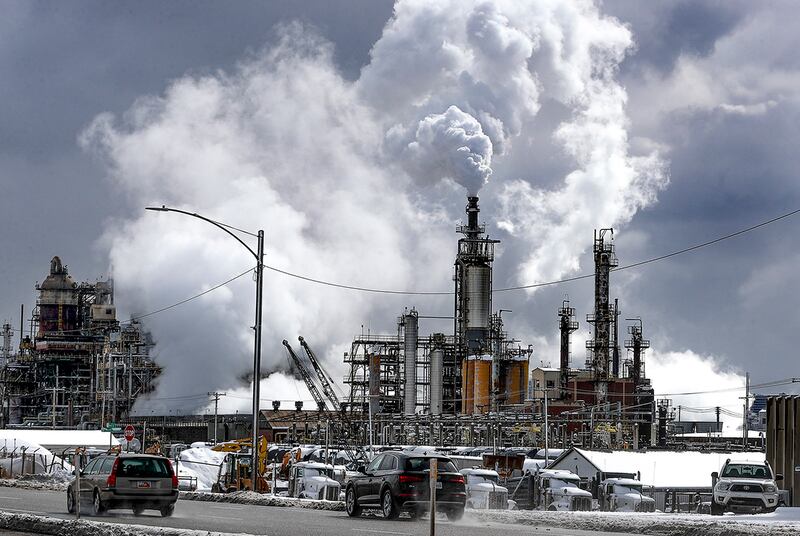 Plumes rise from the Marathon refinery on a cold morning in Salt Lake City on Wednesday, Feb. 17, 2021.