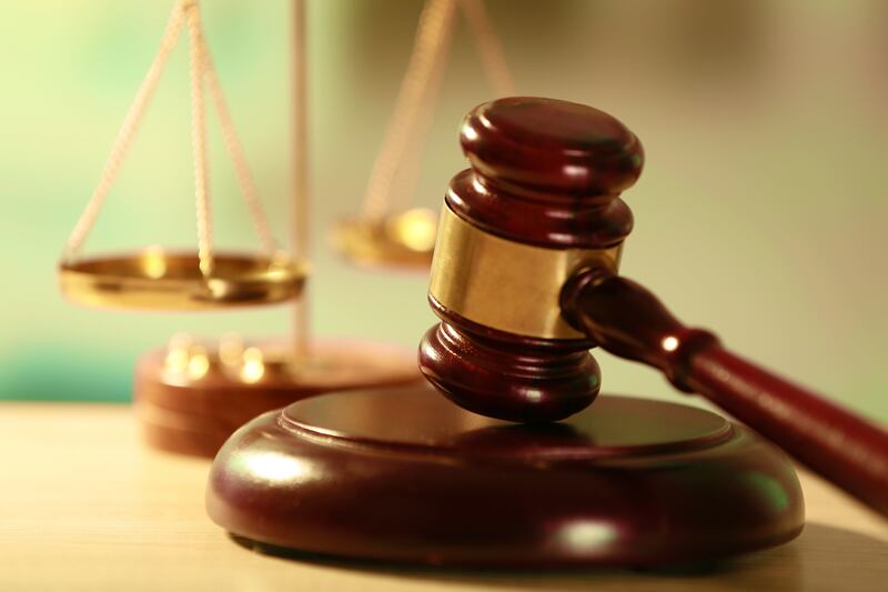 A man already serving up to life in prison for being convicted of murder — a crime he committed while out on bail after being charged with rape — is still causing problems in prison, according to charging documents.