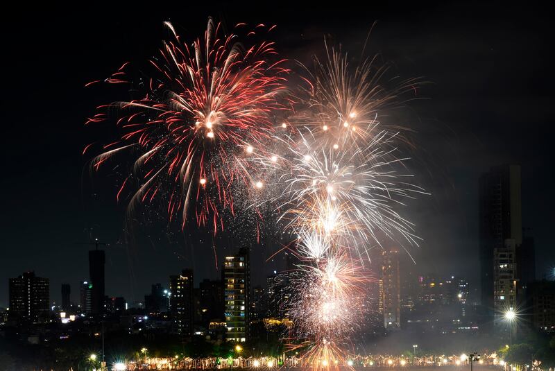 Firecrackers light up the sky to celebrate Diwali festival in Mumbai, India, Friday, Oct. 21, 2022.