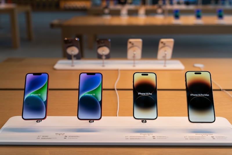 The new iPhone 14 smartphones are on display at an Apple Store at The Grove in Los Angeles.