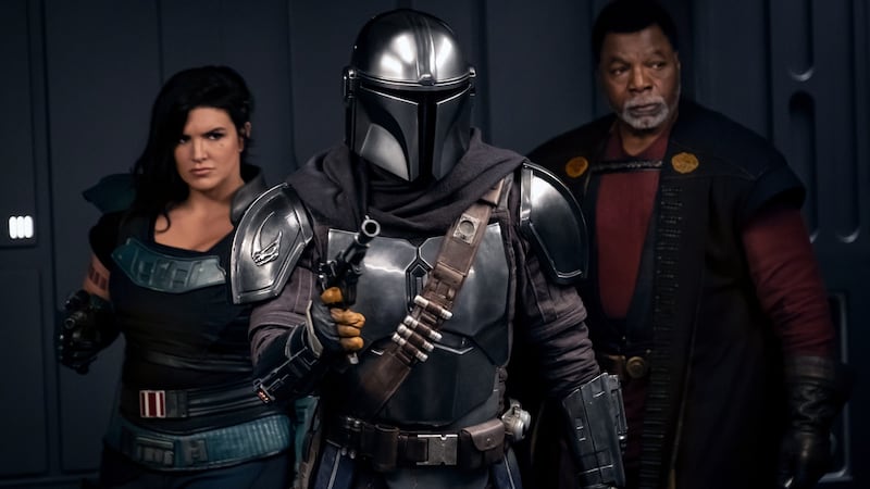 The Mandalorian (Pedro Pascal) meeting with Cara Dune (Gina Garano) and Greef Karga (Carl Weathers) in season two of “The Mandalorian.”