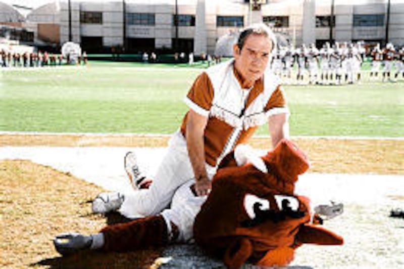 Tommy Lee Jones plays a Texas Ranger protecting a quintet of University of Texas cheerleaders who witness a murder in "Man of the House."