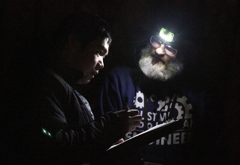 Jimmy, left, who has a job but lives in his car, fills out a questionnaire with Larry Mullin of the Volunteers of America during the annual Point-In-Time Count of the homeless population in Salt Lake City on Thursday, Jan. 30, 2014.