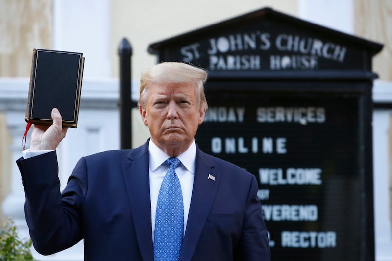 President Donald Trump holds a Bible as he visits outside St. John’s Church across Lafayette Park from the White House in this 2020 file photo.