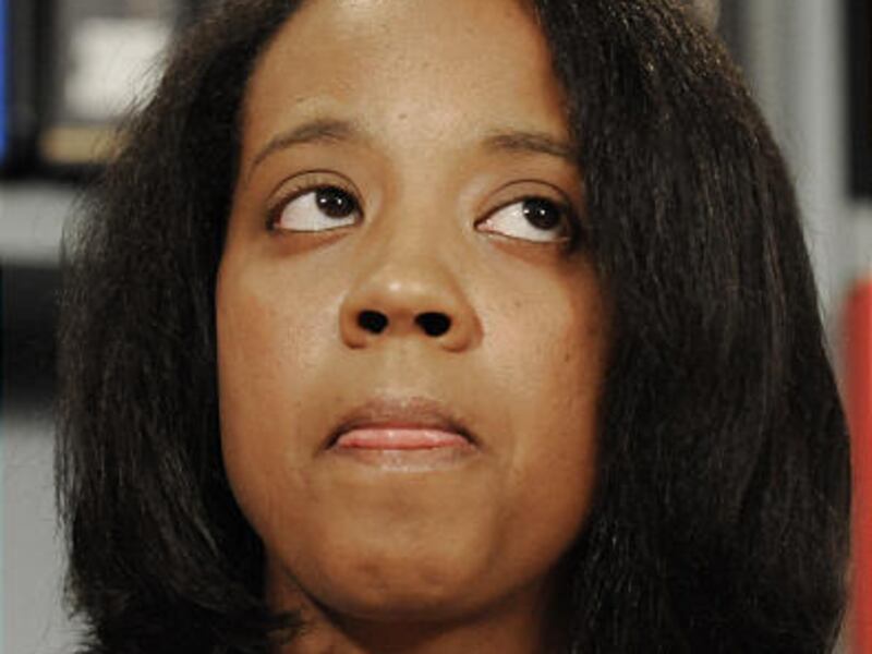 Sheri Lynn Davis attends a news conference Friday. The former science teacher was fired from a charter school.