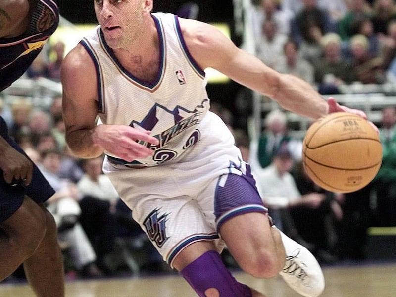 The newest Jazz member, John Crotty, drives past Golden State's Vonteego Cummings on January 23, 2001.