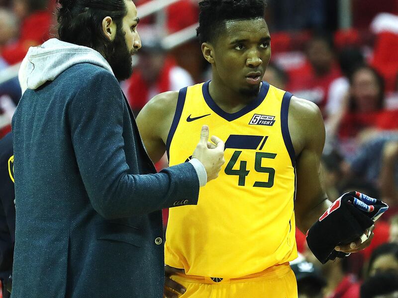 Injured Utah Jazz guard Ricky Rubio (3) talks with Utah Jazz guard Donovan Mitchell (45) during a timeout as the Utah Jazz and the Houston Rockets play game of one of the NBA semifinals in Houston on Sunday, April 29, 2018.