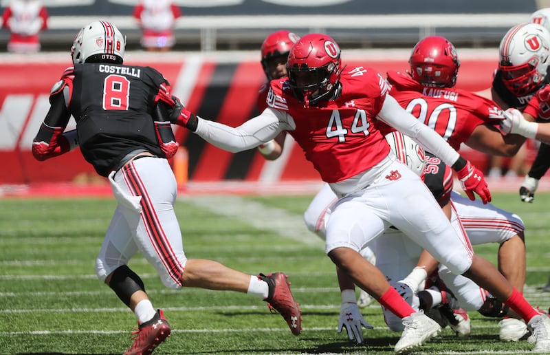 Freshman defensive end Xavier Carlton sacks Peter Costelli in the Red and White game in April in Salt Lake City.