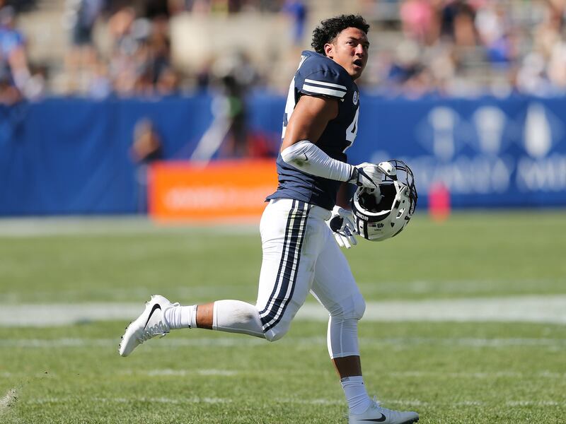 Brigham Young Cougars Langi Tuifua leaves the field after losing his helmet in Provo on Saturday, Aug. 26, 2017. BYU won 20-6.
