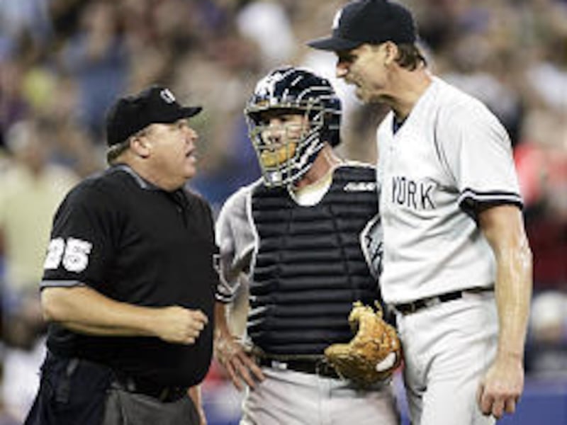 Yankee John Flaherty gets between Randy Johnson and home ump Fieldin Culbreth after ejection call.