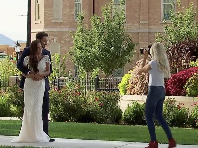 Maquel Cooper is shown photographing a couple in a new commercial for "The Bachelor."