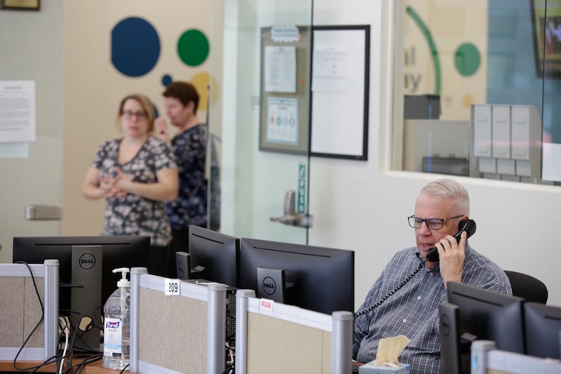Morris Floyd, who has been volunteering at the National Runaway Safeline for 15 years speaks on the phone, Friday, March 23, 2018 in Chicago, Illinois. Floyd helps youth, teens, parents and guardians seeking help with runaway victims or victims who are th