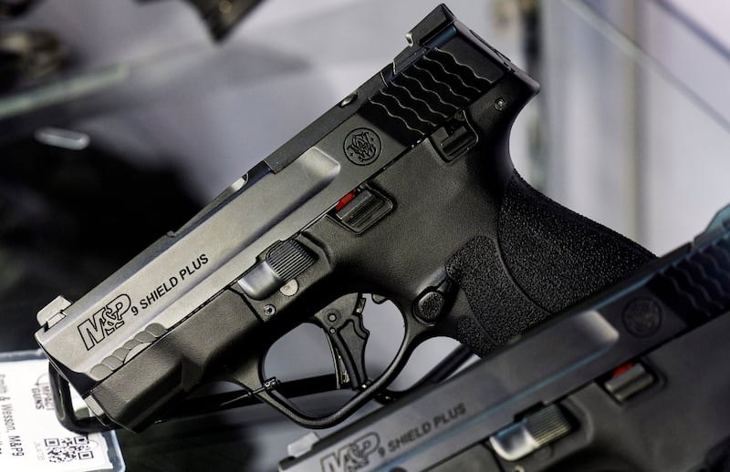 Smith and Wesson pistols are displayed at Impact Guns in South Salt Lake.