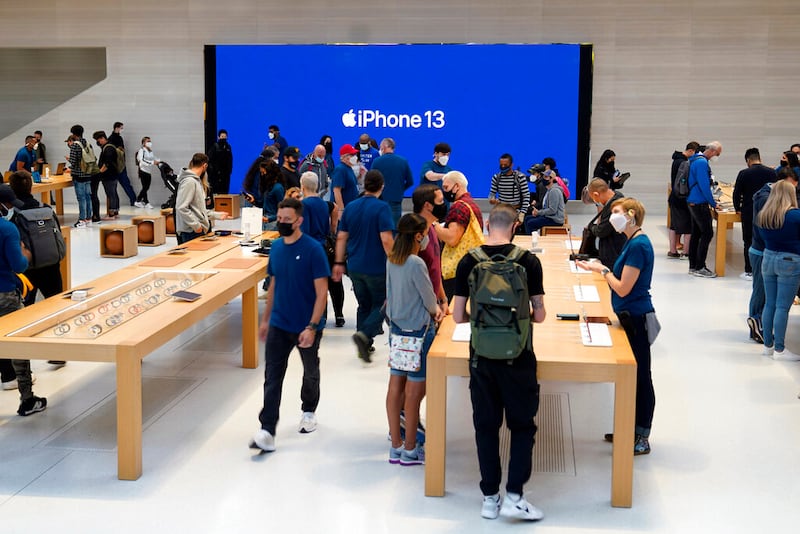 Customers and Apple employees gather during first day of sale