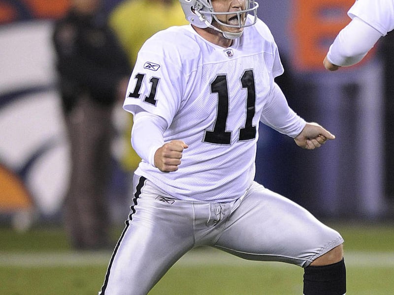 Oakland Raiders kicker Sebastian Janikowski (11) reacts after kicking a 63-yard field goal against the Denver Broncos in the second quarter of an NFL football game, Monday, Sept. 12, 2011, in Denver. Janikowski tied an NFL record with the field goal and t