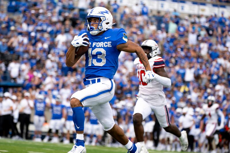 Air Force wide receiver Jared Roznos (13) runs in a touchdown during game on Sept. 2, 2023, at Air Force Academy, Colo.