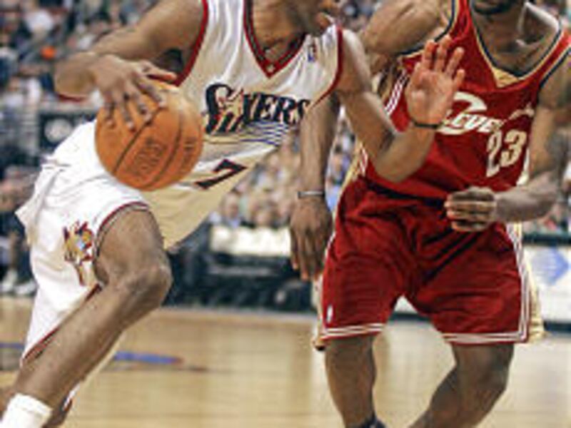 Philadelphia's John Salmons drives on Cleveland's LeBron James during Sixers victory.