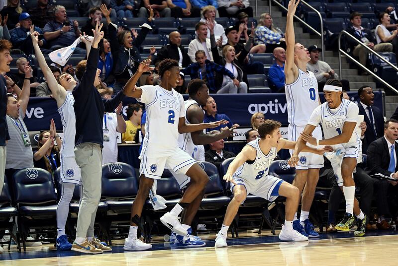 Players on the BYU bench erupt after teammate Jared McGregor (51) dropped in a 3-pointer against Southeastern Louisiana.