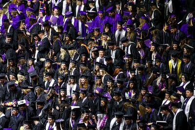 Graduate candidates take their seats at the start of Weber State University’s commencement at the Dee Events Center in Ogden on Friday, April 26, 2019.