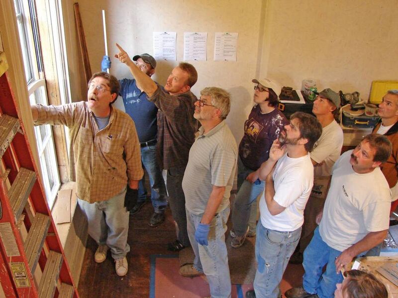 Bob Yapp, left, teaches a window restoration class in 2008.