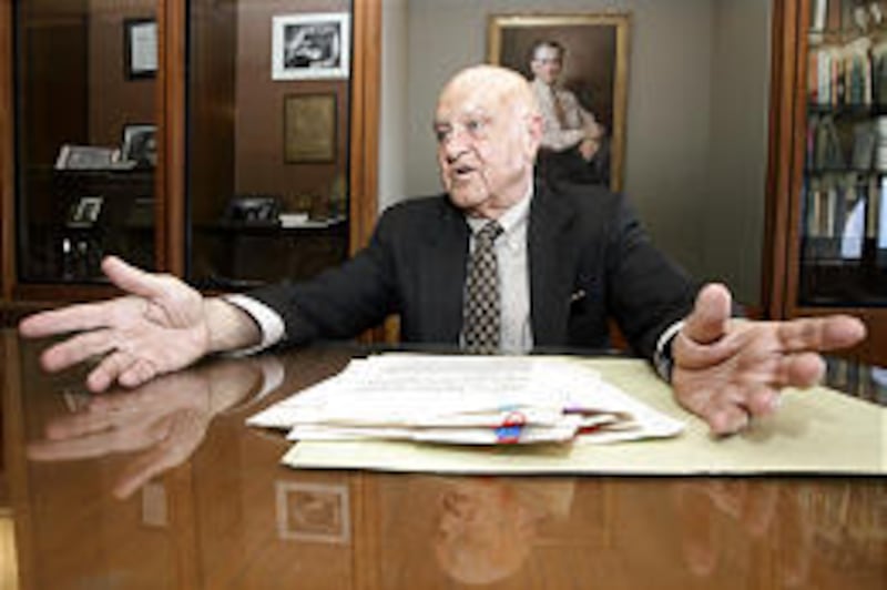 Retired professor William Sessions looks over letters sent between author Flannery O'Connor and her friend, Elizabeth "Betty" Hester.