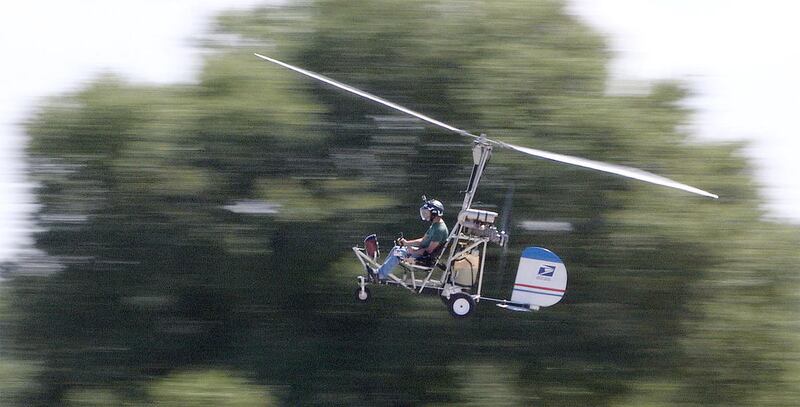 In this March, 2015, photo, Doug Hughes flies his gyrocopter near the Wauchula Municipal Airport in Wauchula, Fla.