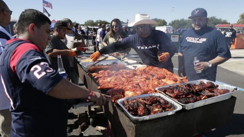 Fans tailgate at a Houston Texas NFL football game in Houston.