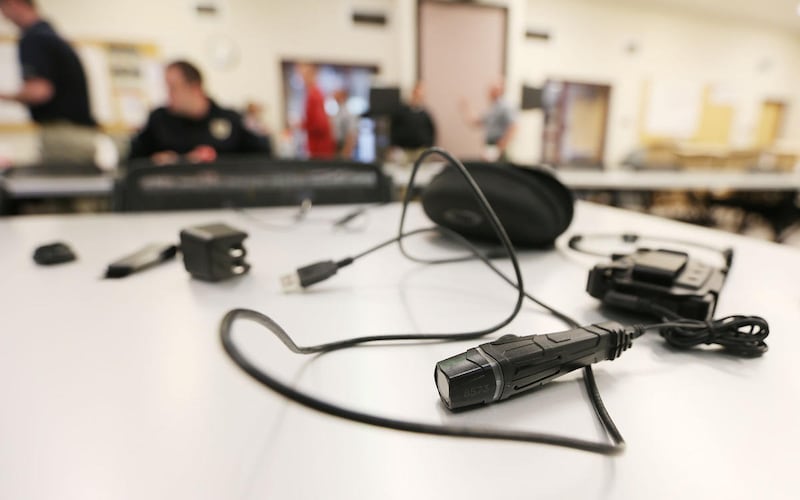 FILE - A body camera lays on a table as West Valley City police officers receive their new cameras Wednesday, Feb. 25, 2015, and are instructed on their use. HB300 requires police to record incidents from start to finish, with exceptions for consulting wi