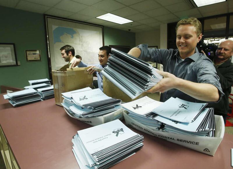 Michael Shey with  Count My Vote drops off a petition with thousands of signatures to the Salt Lake county clerks office in Salt Lake City  Tuesday, March 4, 2014. A majority of Utahns support the Count My Vote effort to allow candidates to get on the pri