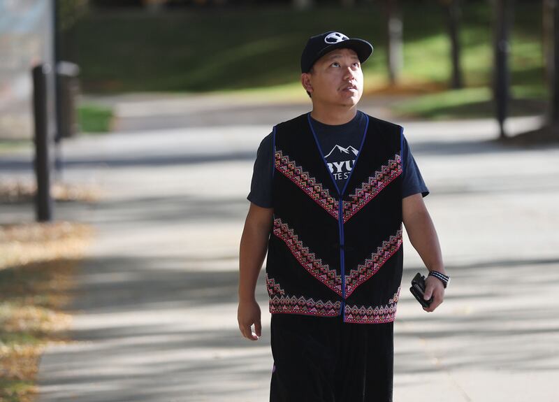 Yang Vang, a Brigham Young University master's degree candidate in anthropology, walks on campus in Provo on Oct. 13. Vang is also a world-renowned Hmong shaman.