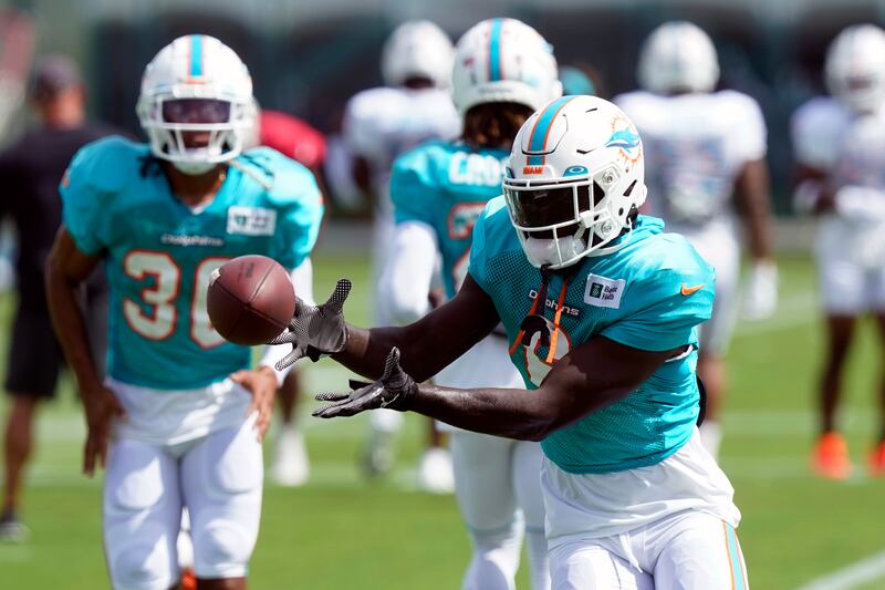 Miami Dolphins cornerback Trill Williams catches the ball during training camp in August 2022.