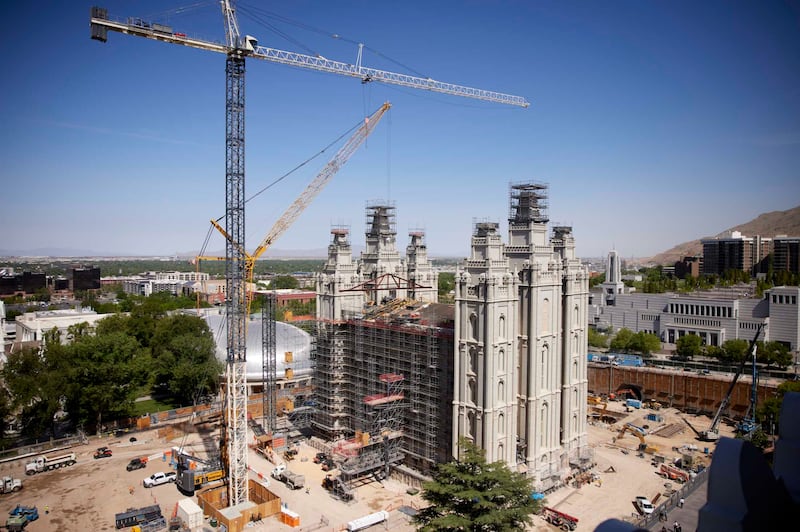 Cranes lift new trusses to the roof of the Salt Lake Temple in Utah.