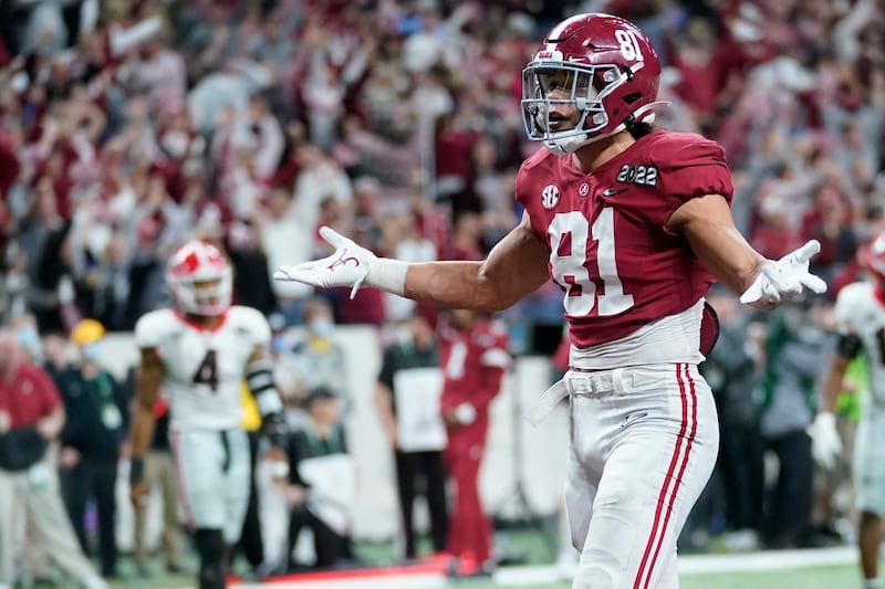 Alabama’s Cameron Latu reacts after catching a touchdown pass during the second half of the College Football Playoff championship football game against Georgia Monday, Jan. 10, 2022, in Indianapolis.