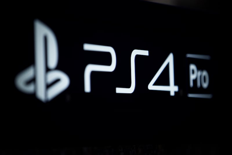 In this Nov. 3, 2017, photo, the logo of the PlayStation 4 Pro is seen at the Paris Games Week in Paris. Sony revealed plans for the new PlayStation 5 in an interview with Wired magazine last week. (AP Photo/Kamil Zihnioglu)