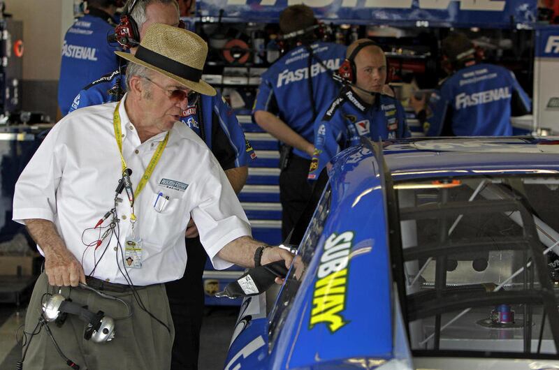 Car owner Jack Roush, left, talks to driver Carl Edwards, in car, in his garage during practice for Sunday's NASCAR Daytona 500 auto race in Daytona Beach, Fla., Wednesday, Feb. 22, 2012.