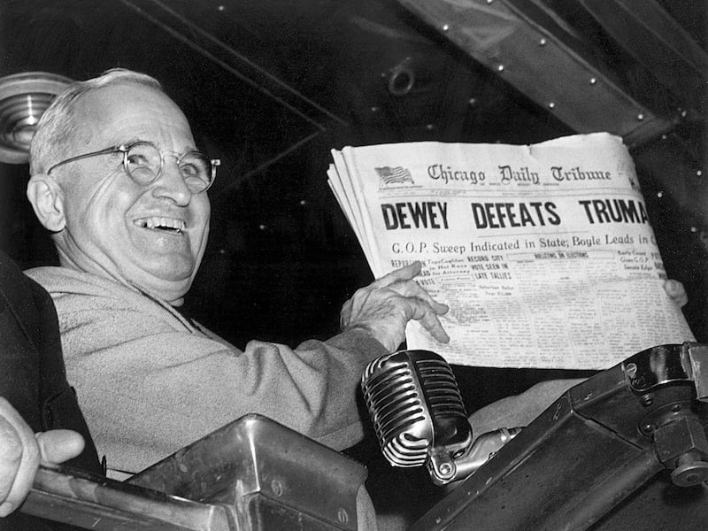 In this Nov. 4, 1948, file photo, President Harry S. Truman at St. Louis’ Union Station holds up an election day edition of the Chicago Daily Tribune, which - based on early results - mistakenly announced “Dewey Defeats Truman.”
