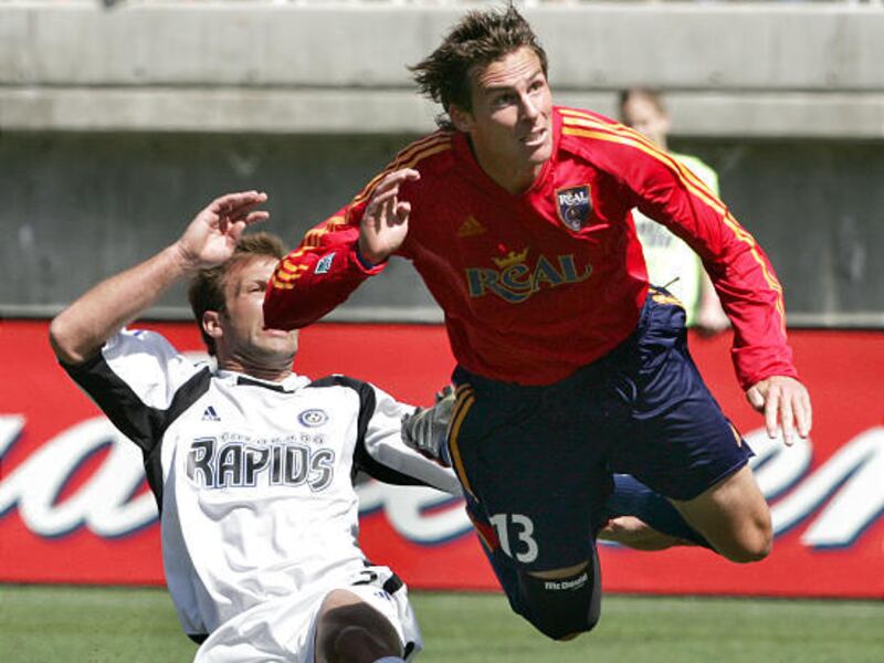 Real's Brian Dunseth watches the ball sail into the goal, with the Rapids' Richie Kotschau in the background, during Real Salt Lake's debut home game, April 16, 2005. Dunseth scored the only goal of the game as Real Salt Lake beat Colorado1-0 at Rice-Eccl