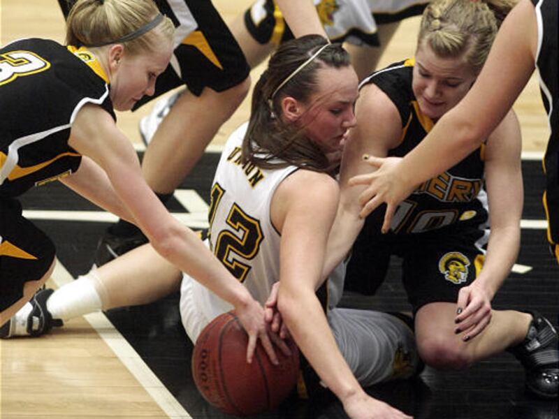 Union's Katie Richens, center, scrambles for the ball between Emery's Tayler Jewkes, left, and Markette Tanner.