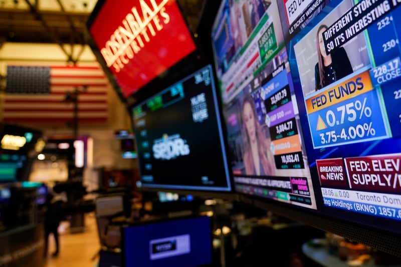 Traders work on the floor at the New York Stock Exchange.