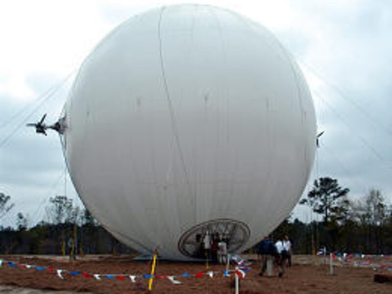 People gather to inspect a 62-foot spherical airship in Columbus, Ga., built by Techsphere Systems International.