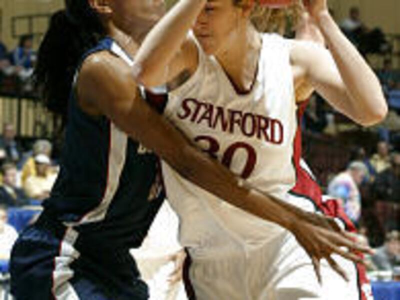 Connecticut's Jessica Moore, left, guards Stanford's Brooke Smith in Sunday's game.
