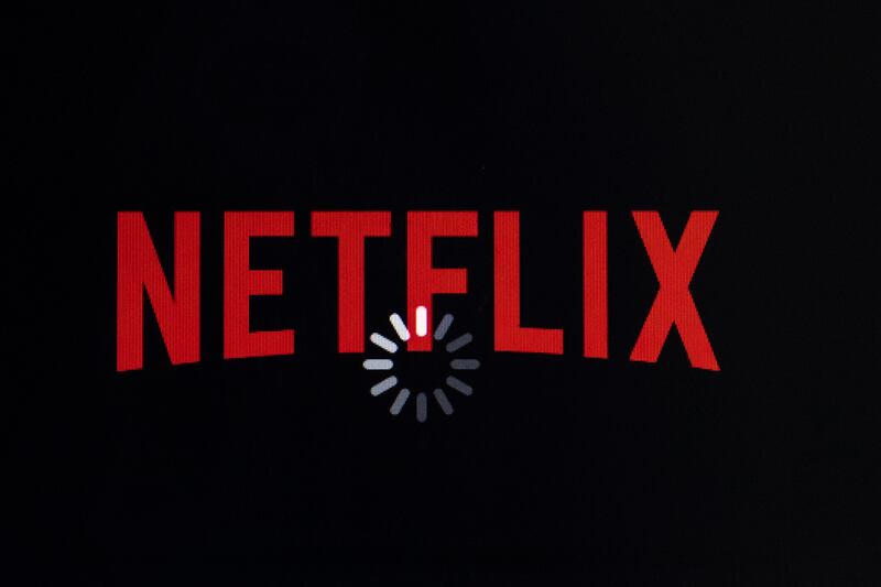 FILE- In this July 17, 2017, file photo the Netflix logo is displayed on an iPhone in Philadelphia. Netflix announce Tuesday, Jan. 15, 2019, that it is raising its prices in the U.S. by 13 percent to 18 percent, depending on the plan, (AP Photo/Matt Rourk