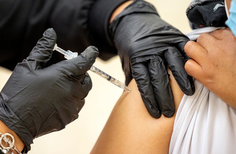 Patricia Lovos gives a COVID-19 vaccination to a woman at the Second Baptist Church in Ogden on Saturday, May 8, 2021.