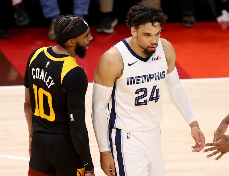 Jazz guard Mike Conley has a few words for Memphis Grizzlies’ Dillon Brooks during a playoff game in Salt Lake City, Utah.