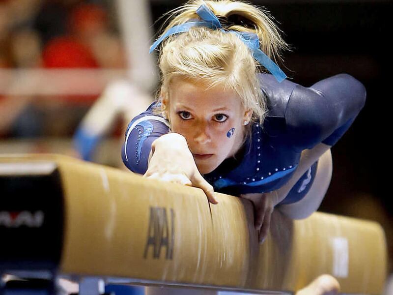 BYU's Emily Vidmar performs on the beam as Utah, BYU, SUU and Boise State compete Saturday, Jan. 11, 2014 in the Huntsman Center.
