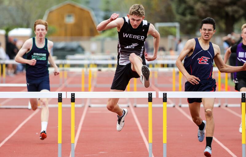 Weber’s Ryan Trane wins the 300-meter hurdles race during the Davis Invitational.